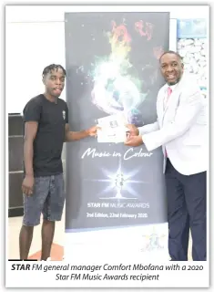  ??  ?? STAR FM general manager Comfort Mbofana with a 2020 Star FM Music Awards recipient