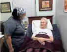  ?? PROVIDED ?? Alberta Semmions is pictured caring for her resident Barabara Taylor at St. Ann’s Skilled Nursing & Therapy in Oklahoma City.