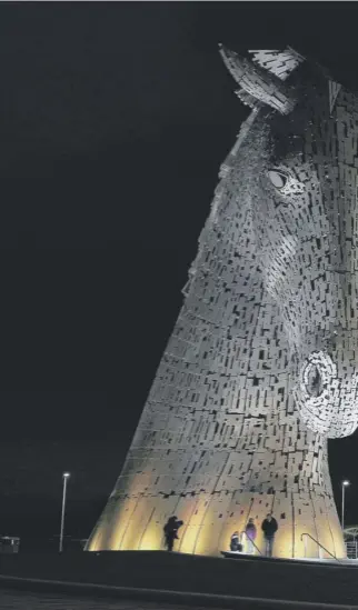  ??  ?? 0 The light-bathed Kelpies were one of the well-known landmarks which were plunged i