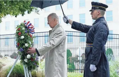  ?? PHOTOS BY SUSAN WALSH/AP ?? President Joe Biden participat­es in a wreath laying ceremony Sunday while visiting the Pentagon in Washington to honor and remember the victims of the Sept. 11, 2001, terrorist attack.