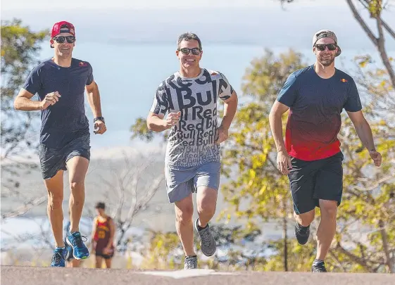  ?? Picture: AAP IMAGE ?? Supercars drivers Jamie Whincup (left) and Shane Van Gisbergen (right) and Team Vortex’s Craig Lowndes during a fitness session in Townsville.