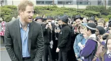  ?? RUI VIEIRA/THE ASSOCIATED PRESS ?? Prince Harry and his girlfriend are reportedly almost living together, with a source saying the couple could get engaged by spring.