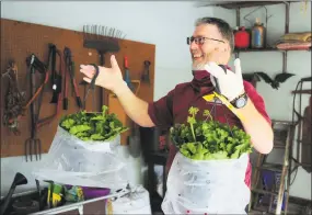  ?? Christian Abraham / Hearst Connecticu­t Media ?? Home Instead Franchise Owner Coleman Gately delivers flower baskets for Mother’s Day to a home in New Canaan on Saturday.