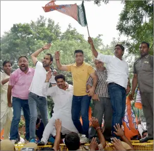  ?? PTI ?? BJP workers protest outside Delhi CM Arvind Kejriwal’s residence in New Delhi on Tuesday. —