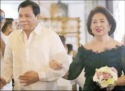  ??  ?? FAMILY TIES: Photo taken on Sept. 17, 2016 shows President Duterte and Ombudsman Conchita Carpio-Morales walking down the aisle as principal sponsors during the wedding of Waldo and Regine Carpio in Intramuros, Manila. Waldo Carpio is a brother of Manases Carpio, husband of Duterte’s daughter Sara. Morales is the sister of Waldo and Manases Carpio’s father.