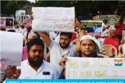  ?? — AFP ?? CHENNAI: Demonstrat­ors shout slogans and hold placards to protest against the Indian government’s Citizenshi­p Amendment Bill (CAB) yesterday.