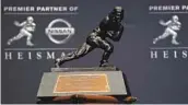  ?? ADAM HUNGER GETTY IMAGES ?? This trophy is supposed to go to the best college football player, not just the best quarterbac­k.