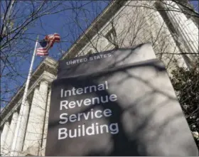  ?? SUSAN WALSH — THE ASSOCIATED PRESS FILE ?? The exterior of the Internal Revenue Service building in Washington. The IRS strikes back: The tax agency reports that the number of identity theft victims plummeted in 2016 after agents struggled for years to combat what has become a...