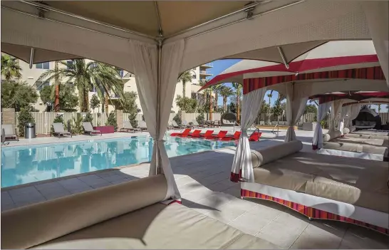  ?? One Las Vegas ?? One Las Vegas high-rise features a pool area with cabanas.