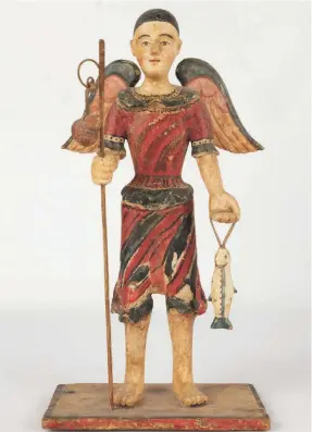  ?? HANDOUT ?? The 13-inch-high antique wooden San Rafael figure with wings and holding a staff and a fish sold at a Cottone auction for $9,600.