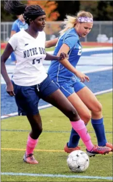  ?? Trentonian photo/ JACKIE SCHEAR ?? Notre Dame’s Vanessa Romulus, left, and Hightstown’s Julia Trost chase a loose ball.