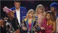  ?? WIREIMAGE ?? Taylor-made win: Taylor Swift and her entourage pick up the best video gong at last year’s event