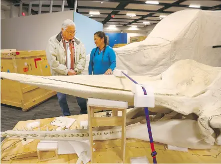  ?? JIM WELLS ?? Casey Eagle Speaker, left, is joined by Maori representa­tive Moana Parata from the National Museum of New Zealand as organizers begin to set up the Whales|Tohorā touring exhibit coming to Telus Spark on Jan. 20. Calgary is the final stop of a...