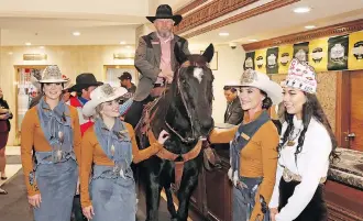  ?? GAVIN YOUNG ?? Former Calgary Grey Cup Committee chair Fletcher Armstrong rides quarter-horse Tuffy the into the lobby at Edmonton’s Chateau Lacombe Hotel on Thursday to continue a tradition dating back to 1948.