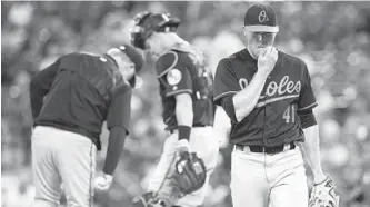  ?? RICHARD W. RODRIGUEZ/ASSOCIATED PRESS ?? Orioles starting pitcher David Hess (41) is removed during the fourth inning by manager Buck Showalter, left. Hess was charged with five earned runs (seven overall) over just 31⁄ innings, which inflated his ERA to 6.41.