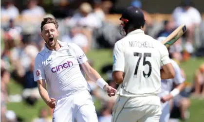  ?? ?? Ollie Robinson celebrates snaring the wicket of New Zealand’s Daryl Mitchell on his way to four for 54. Photograph: Phil Walter/Getty Images