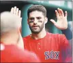  ?? Michael Dwyer / Associated Press ?? J.D. Martinez has decided to remain with the Red Sox instead of becoming a free agent.