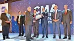  ?? ?? Director /CFO of DIMO Mr. Suresh Gooneratne receiving the certificat­e for "Five Excellent Integrated Reports”. Mr. Suresh Gooneratne was also honoured with the CMA CFO Excellence Award at the ceremony.