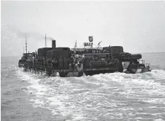  ??  ?? ■ The stern of a fully loaded transport ferry, this image showing the camouflage patterns applied to the vessels.