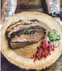  ??  ?? The beef brisket is slowsmoked for 18 to 22 hours remains to be one of the restaurant’s bestseller­s.