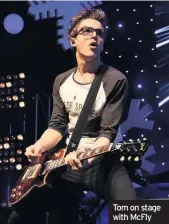 ??  ?? Tom on stage with McFly