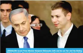  ??  ?? JERUSALEM: Israeli Prime Minister Benjamin Netanyahu (left) and his son Yair visit the Wailing Wall in Jerusalem. The Israeli premier’s son has been caught on tape seemingly drunk outside a strip club talking about a key natural gas deal, leading to...