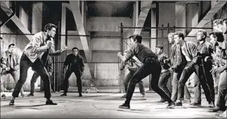 ?? George Rinhart Corbis via Getty Images ?? IN A SCENE from the 1961 film “West Side Story,” the Jets and the Sharks prepare to fight.