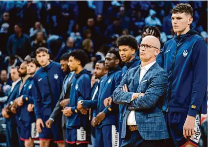  ?? Chris Szagola/Associated Press ?? Head coach Dan Hurley’s Huskies are trying to become the first team to win back-to-back national championsh­ips in 17 years.