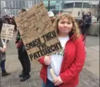  ??  ?? Left: Robin Johnson’s sign speaks her mind. Right: Another woman’s sign issues a call for human rights.