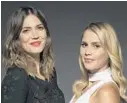  ?? RON ESHEL/INVISION/AP ?? Mandy Moore, left, and Claire Holt play sisters who go shark diving in a rickity cage on vacation in “47 Meters Down.”