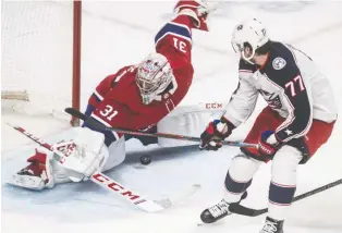  ?? DAVE SIDAWAY ?? Canadiens goaltender Carey Price stops right winger Josh Anderson — then with the Blue Jackets and now with Montreal — during a close-in attempt in 2019.