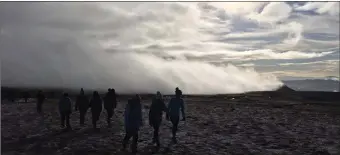  ??  ?? Hikers take in the sights on Benbulben