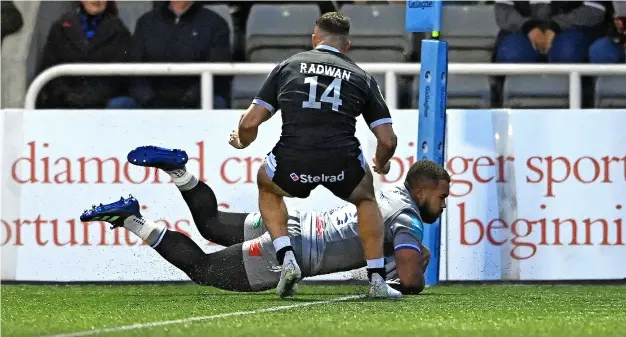  ?? PICTURE: Stu Forster/getty Images ?? Ollie Lawrence dots down for Bath Rugby’s second try during their victory over Newcastle Falcons