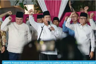  ?? ?? JAKARTA: Prabowo Subianto (center), accompanie­d by his coalition party leaders, delivers his victory speech at his residence on March 20, 2024. — AFP