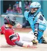  ?? TOM E. PUSKAR / THE ASSOCIATED PRESS ?? Puerto Rico catcher John Lopez tags out Canada’s Cole Balkovec in Wednesday’s game.