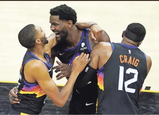  ?? PHOTOS BY ROB SCHUMACHER/THE REPUBLIC ?? Suns center Deandre Ayton (22) celebrates after making the game-winning dunk over Clippers center Ivica Zubac (not pictured) during Game 2 on Tuesday in Phoenix.