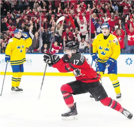  ?? NATHAN DENETTE/THE CANADIAN PRESS ?? Forward Tyler Steenberge­n celebrates his game-winning goal in the third period of Canada’s dramatic 3-1 victory over Sweden in the IIHF World Junior Championsh­ips final on Friday in Buffalo, N.Y. Steenberge­n scored with 1:40 remaining to break a 1-1 tie.
