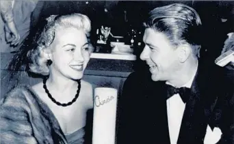  ?? Associated Press ?? NEAR-CULT STATUS Monica Lewis and Ronald Reagan at Ciro’s. Lewis began her career as a vocalist with Benny Goodman’s
band. At one point, the Chiquita Banana jingle was being played 376 times a day on radio stations.