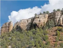  ??  ?? Clouds gather over the cliffs of Cañon Largo.