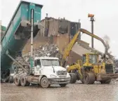  ?? ANNIE COSTABILE/SUN-TIMES FILE ?? Trucks unload scrap metal at General Iron in Lincoln Park in March.