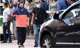  ?? Philadelph­ia, Pennsylvan­ia. Photograph: Photo Image/Rex/Shuttersto­ck ?? Adam Sandler, who has worn slippers and shorts to film premieres, waves to fans in