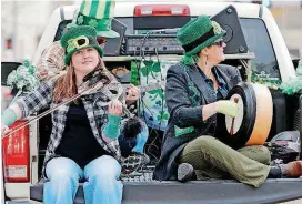  ?? [PHOTO BY DOUG HOKE, THE OKLAHOMAN ARCHIVES] ?? Ravens Three performs March 17 at the St. Patrick’s Day Parade in downtown Oklahoma City. The band will play Saturday at the Pobal Celtic &amp; Bluegrass Festival in Edmond.