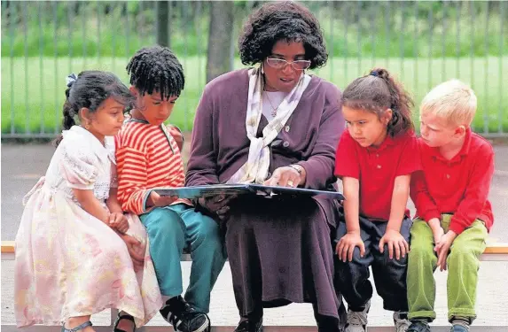  ??  ?? > Betty Campbell with youngsters Ayat Mohammed, Videl Farrah, Ellis Parsons and Keiron Perry