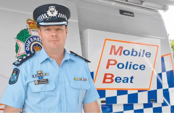  ?? ?? Inspector Dean Cavanagh at the mobile police beat which was stationed at Bulletin Square.