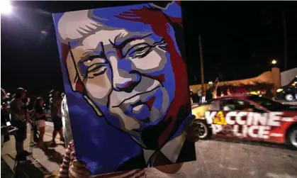  ?? Photograph: Cristóbal Herrera/EPA ?? Supporters of Donald Trump stand outside Mar-a-Lago in Palm Beach, Florida.