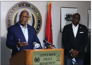  ?? (Arkansas Democrat-Gazette/Thomas Metthe) ?? Little Rock Police Chief Keith Humphrey (left) gives details Saturday about the officer-involved shooting in which a suspect was killed Friday by police after he shot an 11-year-old boy. At right is Little Rock Mayor Frank Scott Jr.