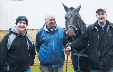  ??  ?? Pictured from left are owner/breeder Pete Ransom, trainer Chris Hunter and owner/breeder Rowan Blackshaw with Choosa Cruiser after their win.