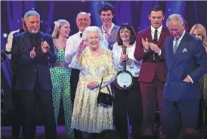  ?? REUTERS ?? Britain's Queen Elizabeth waves to the audience during a special concert to celebrate her 92nd birthday at the Royal Albert Hall in London, on Saturday.