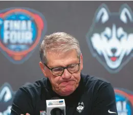  ?? CHAMBERS/GETTY ?? Head coach Geno Auriemma of the UConn Huskies speaks with the media after losing to the Iowa Hawkeyes in the NCAA Women’s Basketball Tournament Final Four semifinal game at Rocket Mortgage Fieldhouse on Friday.STEPH