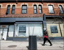  ?? CP FILE PHOTO ?? Space available signs are shown on storefront­s on Queen Street in Toronto on April 16, 2020.